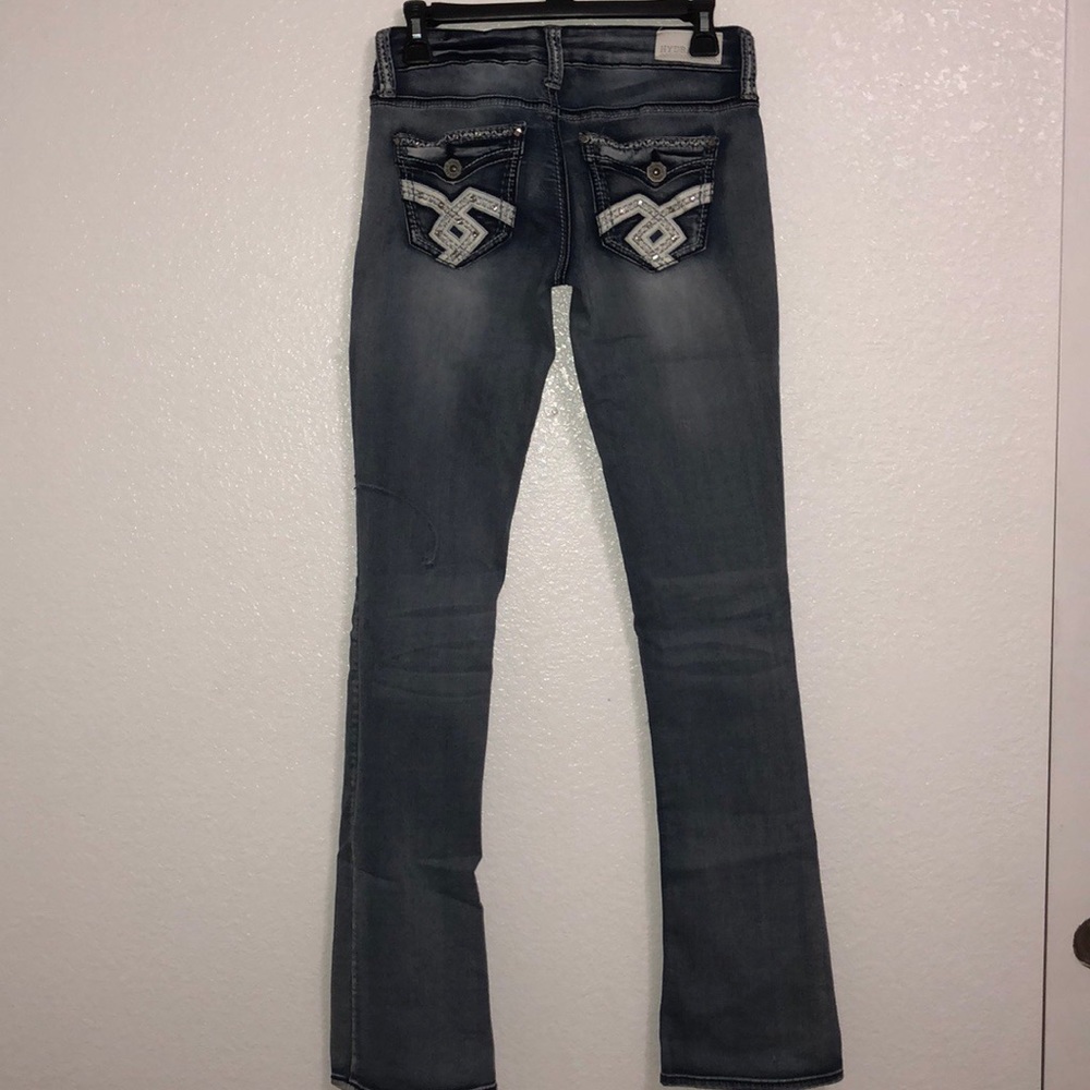 Hydraulic blue jeans, flared ends